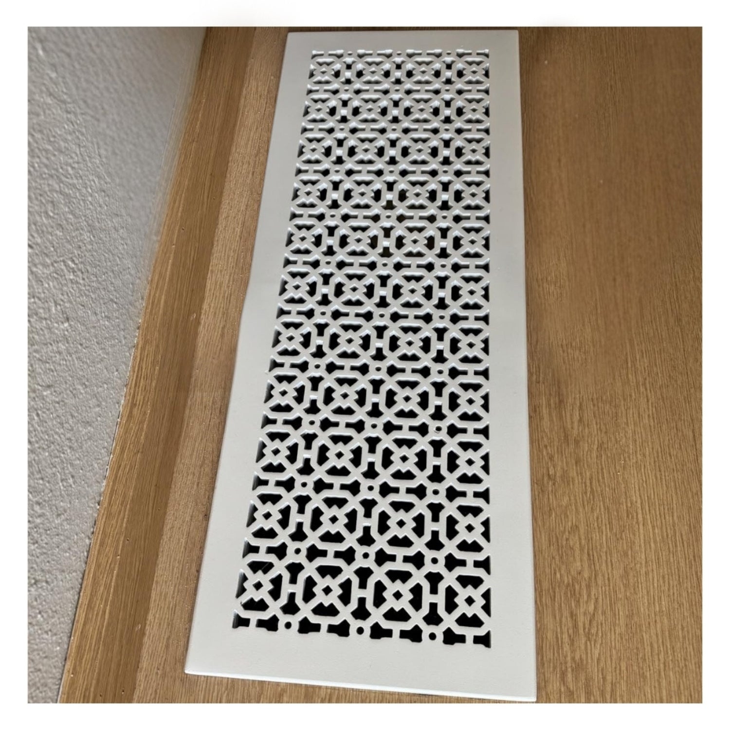 Achtek 8x24 powder coated white air return vent cover for floor installation, geometric pattern, gravity drop installations