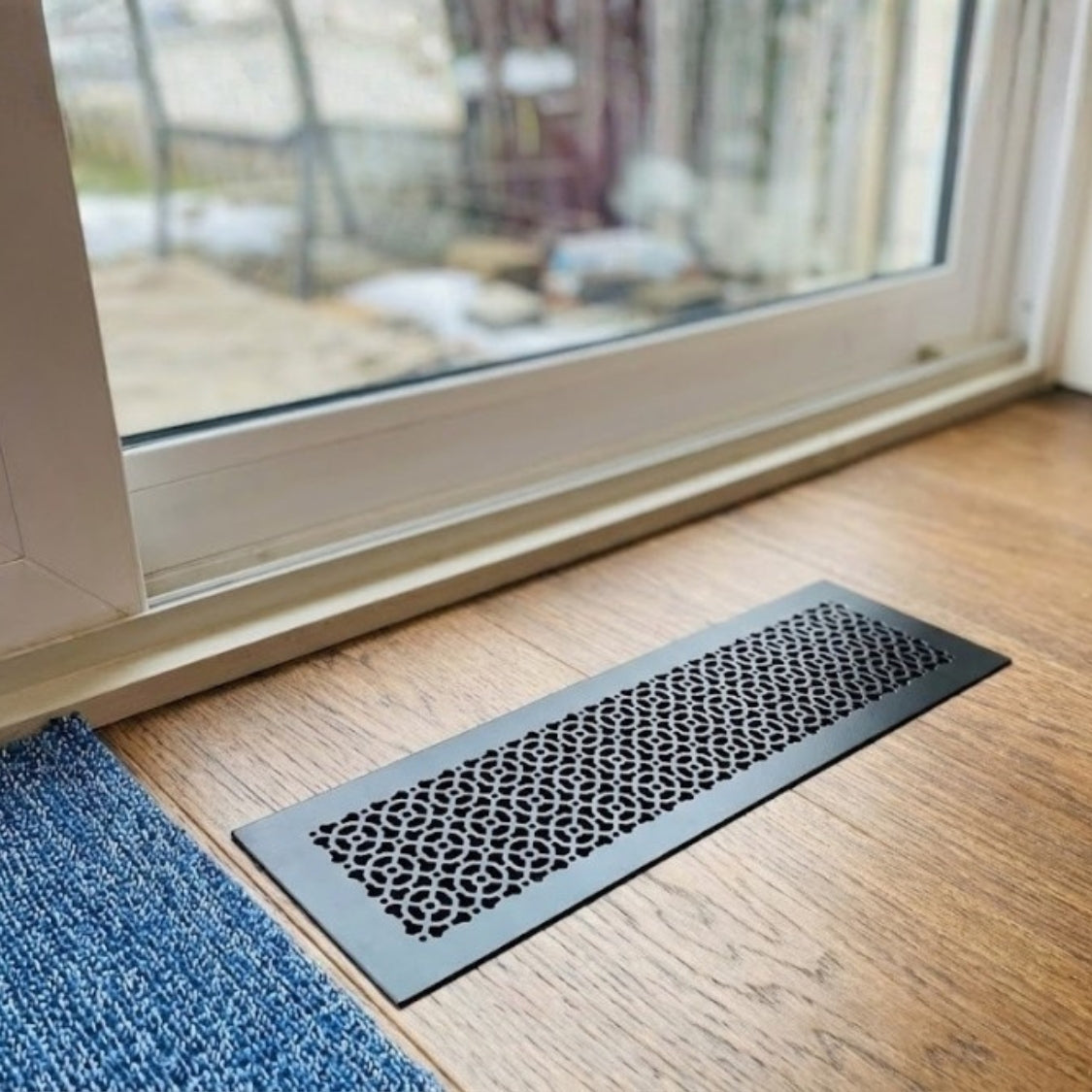 Achtek 8x30 matte black air return vent cover with geometric pattern for floor mounting, gravity drop installations